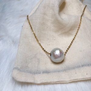 Huge pearl on gold chain necklace